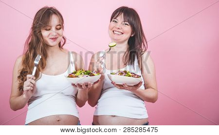 Maternity Concept, Two Pregnant Woman Eating Fresh Salad