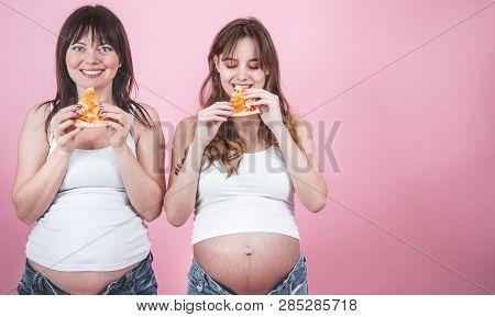 Nutrition Concept, Pregnant Women Eating Pizza On A Pink Background