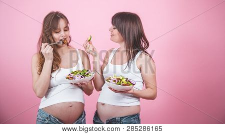 Maternity Concept, Two Pregnant Woman Eating Fresh Salad