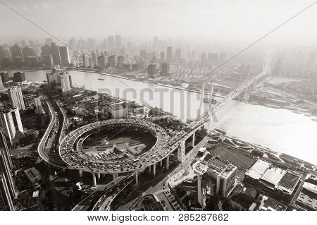 Shanghai Nanpu Bridge over Huangpu River with busy traffic in China.