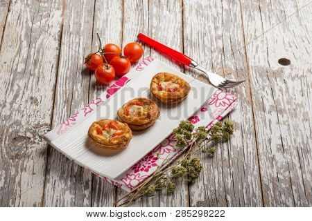 mini pizzas with tomatoes mozzarella and oregano