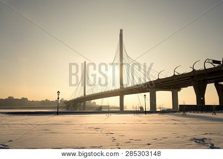 Cable Bridge Across The Petrovsky Fairway At Winter Sunset In Saint Petersburg, Russia. Part Of The 