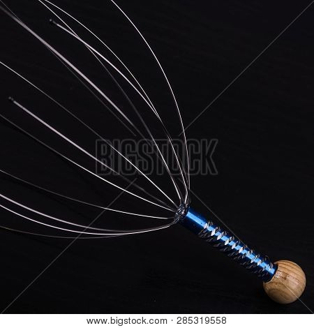 Device For Head Massage. Black Background. Orgasm. Relaxation.