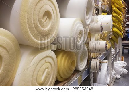 Rolls White And Yellow Foam Rubber Building Material Texture.