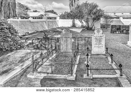 Clanwilliam, South Africa, August 28, 2018: An Historic Plow And Graves At The First Dutch Reformed 