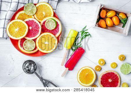 Homemade Ice-cream With Oranges And Lime On Table Top View