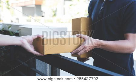 Delivery Mail Man Giving Parcel Box To Recipient, Young Owner Accepting Of Cardboard Boxes Package F
