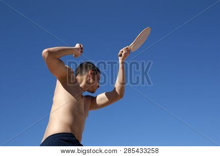 The Guy Plays Matkot On The Beach