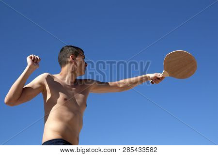 The Guy Plays Matkot On The Beach