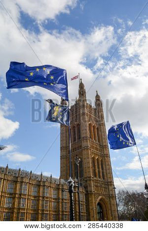 E.u. Flag Flying In Front Of Union Ack Flag At Houses Of Parliament London