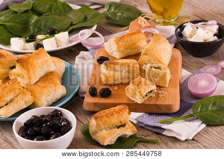 Spinach Puffs With Feta Cheese On Cuttingboard.
