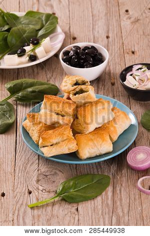Spinach Puffs With Feta Cheese On Cuttingboard.