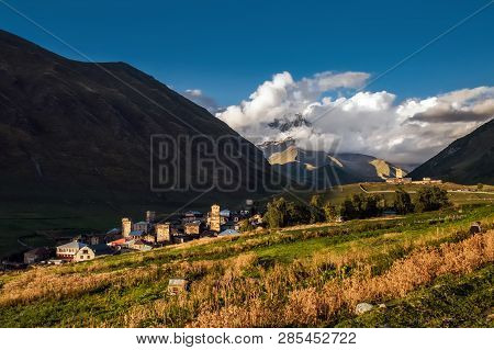 Ushguli Village With A Shkhara Mountain Hiding In The Clouds On The Background. Chvibiani And Zhibia