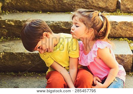 Couple Of Little Children. Boy And Girl. Childhood First Love. Small Girl And Boy On Stairs. Relatio