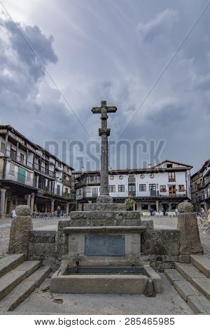 Alberca, Salamanca, Spain; June 2015: Cross And Buildings Of The Main Square Of The Medieval Village