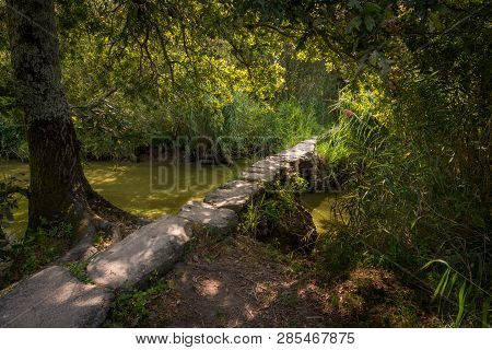 The Small Roman Footbridge Pont De Gras Near Saint-lyphard (france) On A Sunny Day In Summer