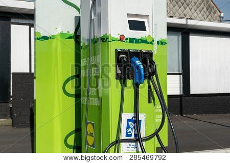 Mouscron,belgium-february 17,2019: Free Distributor For Charging Electric Car Current In Lidl Superm