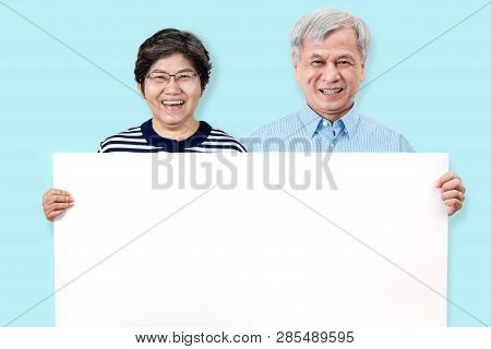 Happy Grandpa And Grandma Smiling With White Teeth, Enjoy Moment And Holding A Blank Board. Asian Gr