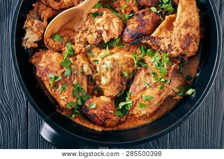 Overhead View Of Kuku Paka, Kenyan Chargrilled Chicken In Creamy Spicy Coconut Sauce In A Earthenwar