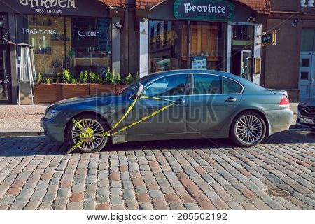 Old Town Street And Locked Car Whell, Bmw. Sunny Winter Day. Travel Urban Photo 2019.