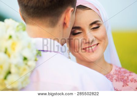 National Wedding. Bride And Groom In Field. Wedding Muslim Couple During The Marriage Ceremony. Musl