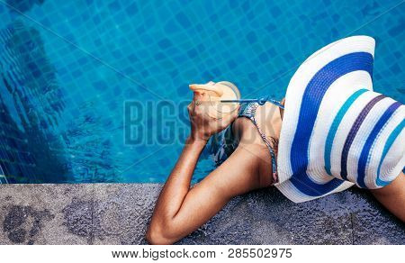 A Beauty Asian Woman Enjoying With Her Summer Vacation At Swimming Pool In Pattaya, Thailand.