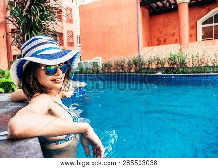 A Beauty Asian Woman Enjoying With Her Summer Vacation At Swimming Pool, Thailand.