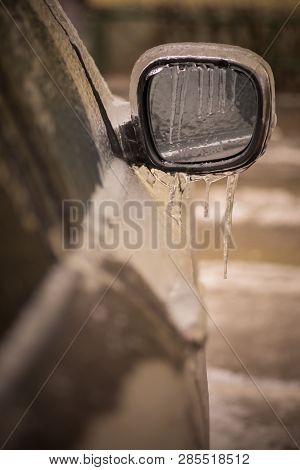 Close Up Shot Of A Frozen Car Mirror After Freezing Rain.
