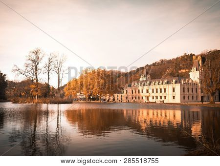 Magical Autumn Lake Reflection Landscape In The Park Of Castle Hernstein In Austria