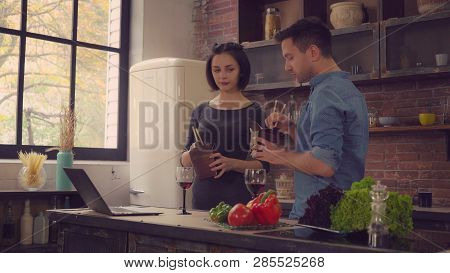Friends Eating Takeout Chinese Food Drinking Red Wine At Home. Man And Woman Enjoy Early Dinner Or L