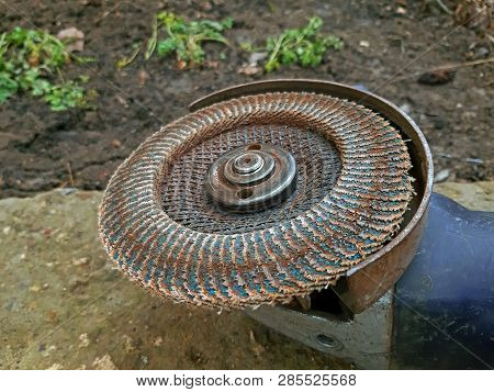 Electric Sander With A Used Disc Close Up