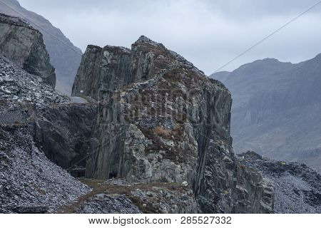 Landscape Image Of Dinorwig Slate Mine Discused Quarry In Snowdonia Showing Scale Of Works And Tiny 