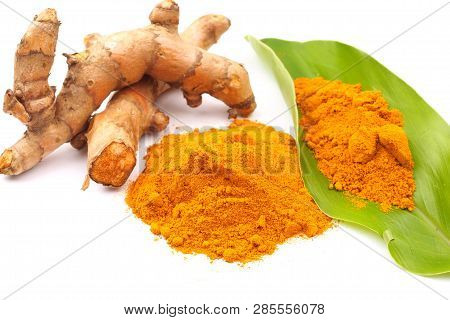 Turmeric Powder And Fresh Turmeric (curcuma) With Green Leaf On White Background. Herbal