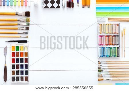 Creative Tools Desk With Drawing Painting Supplies, Colorful Paints Brushes Pencils Crayons And Scho