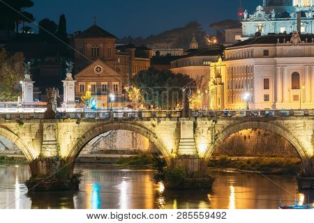 Rome, Italy. Hospital Of Holy Spirit And Aelian Bridge In Evening Night Illuminations.
