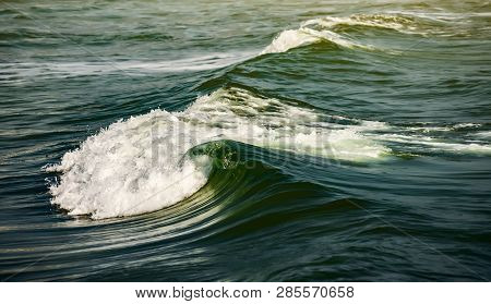 Sea Wave. Massive Blue Wave Breaks. With Flare.