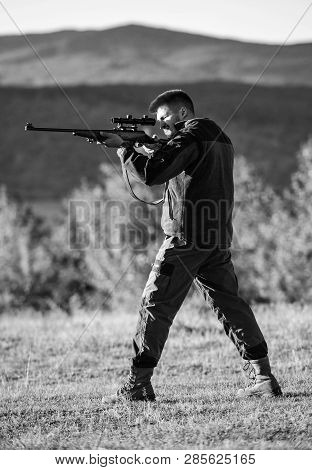 Man Rifle For Hunt. Hunter Khaki Clothes Ready To Hunt Hold Gun Mountains Background. Hunter With Ri