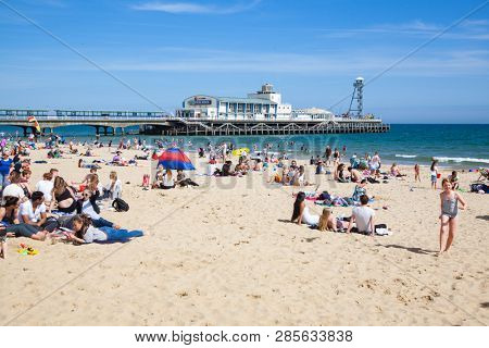 BOURNEMOUTH, UK - 1st JUNE, 2017: Bournemouth beach pier and coast, Dorset