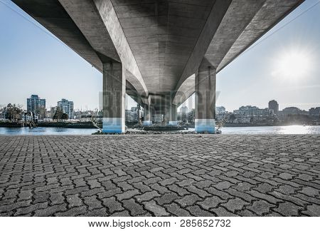 empty concrete square floor under cambie bridge.