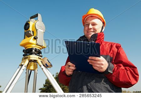 surveyor worker with theodolite