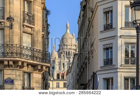 Paris, France, March 26 2017: SacrÃ©-coeur basilica and haussmann building in Paris
