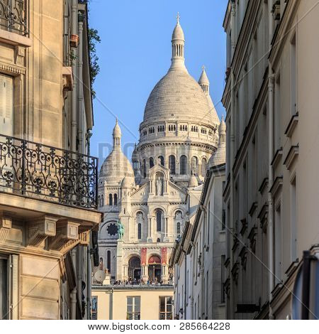 Paris, France, March 26 2017: SacrÃ©-coeur basilica and haussmann building in Paris