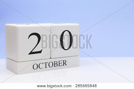 October 20st. Day 20 Of Month, Daily Calendar On White Table With Reflection, With Light Blue Backgr