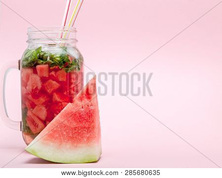 Watermelon Smoothie With Slice Of Fruit And Leaf Of Mint Over Pink Background, Copy Space, Close Up