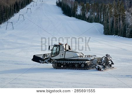 Snowcat On The Mountain Frosty Winter Day. Snowcat Is Equal To Snow On A Ski Slope In A Ski Resort. 