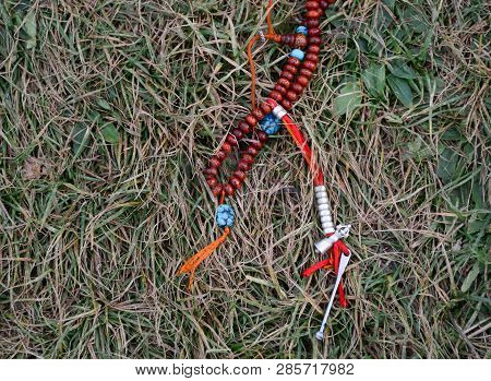 Tibetan Buddhist Or Hinduist Japa Mala (prayer Beads) On Grass.