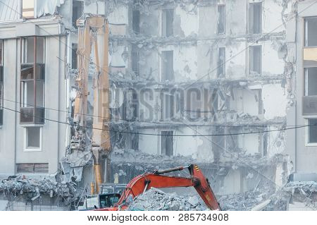 Cleaning Of Construction Debris With A Bucket Of An Excavator/ Building Demolition Excavator, Heavy 
