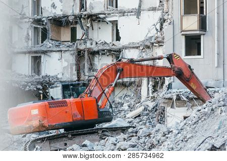 Cleaning Of Construction Debris With A Bucket Of An Excavator/ Building Demolition Excavator, Heavy 