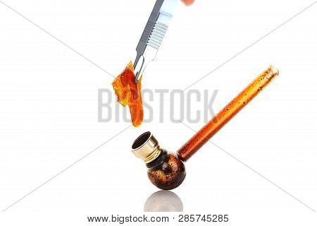 Marijuana Concentrate Shatter And Glass Pipe With Residue Isolated On White Background.