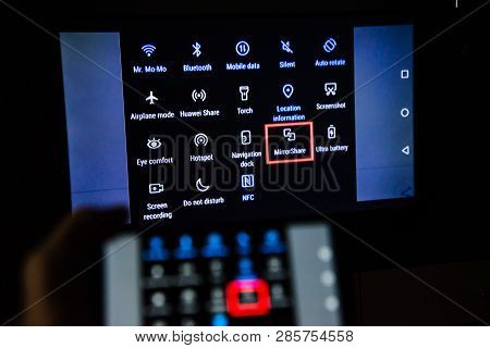 Los Angeles, California, Usa - February 21, 2019. Hands Holding A Smartphone On The Background Of Th